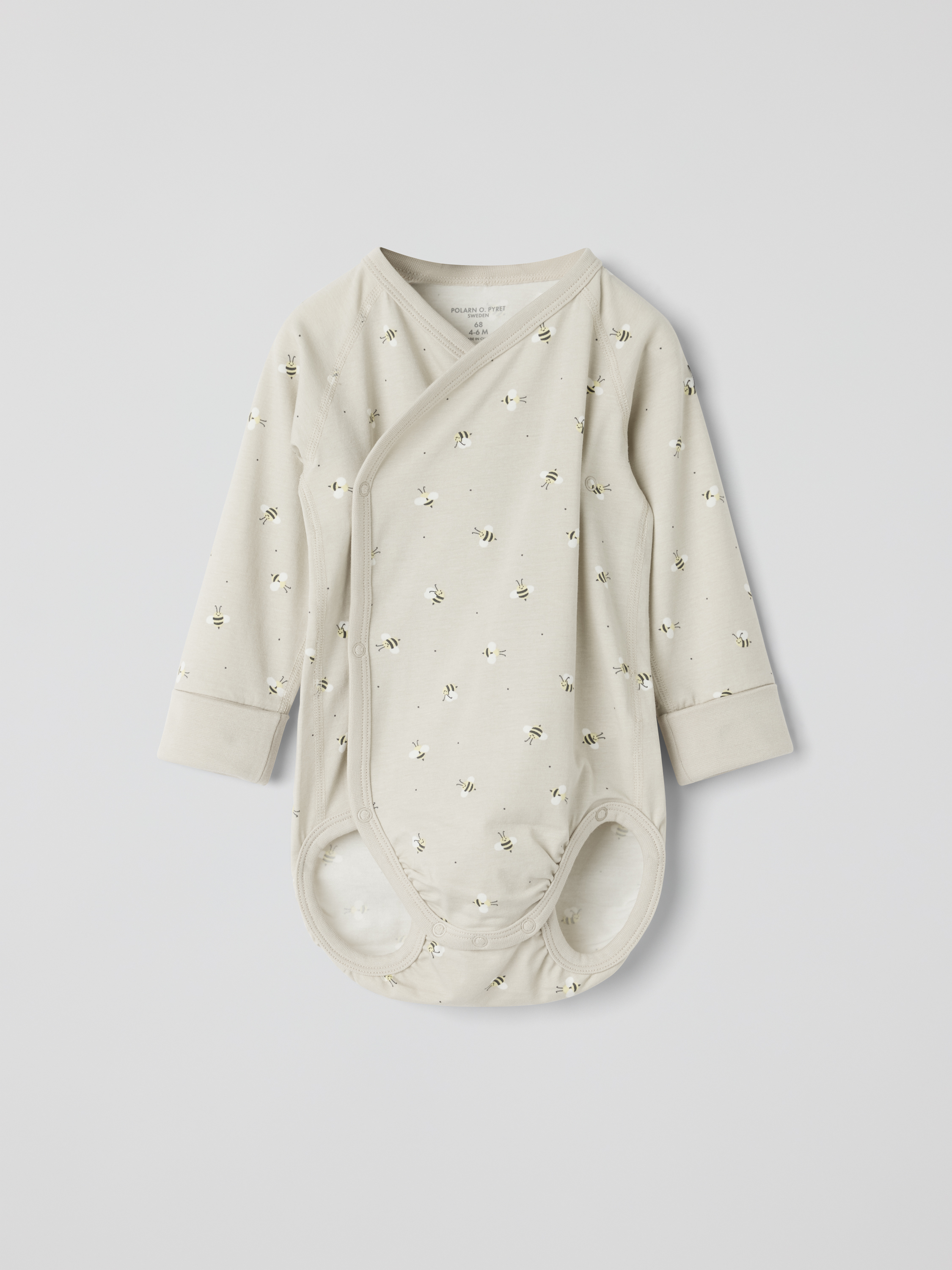 Pidennettävä kietaisubody mehiläiskuviolla