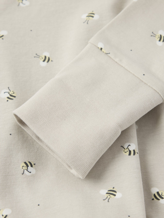 Pidennettävä kietaisubody mehiläiskuviolla