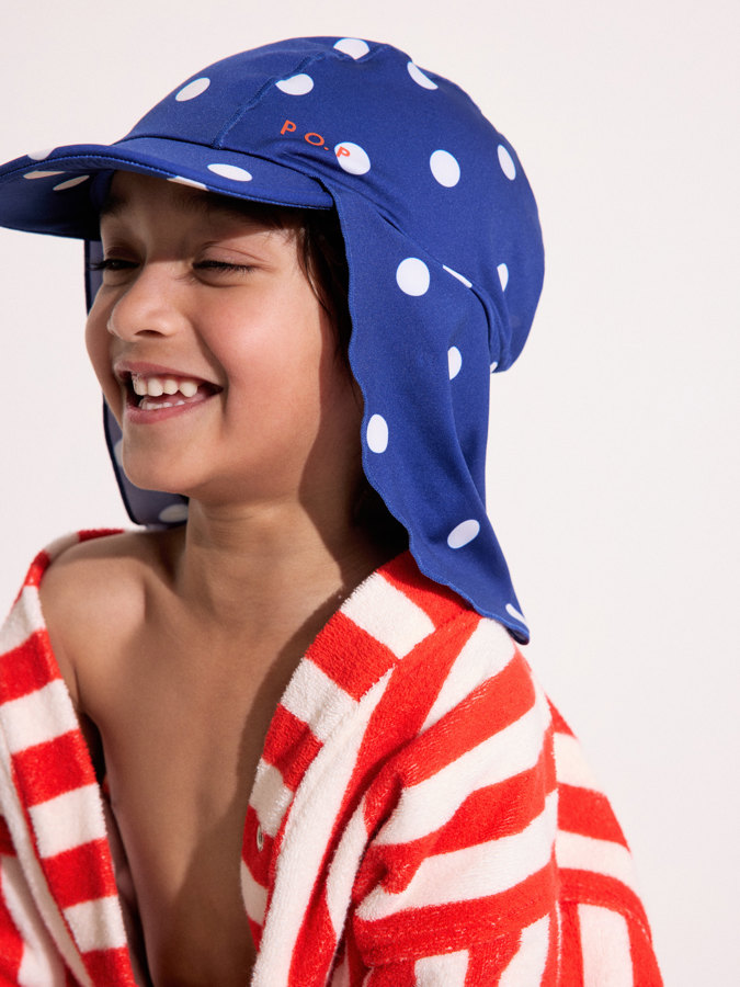 UV-lippalakki niskasuojalla pilkullinen UV-lippalakki niskasuojalla pilkullinen