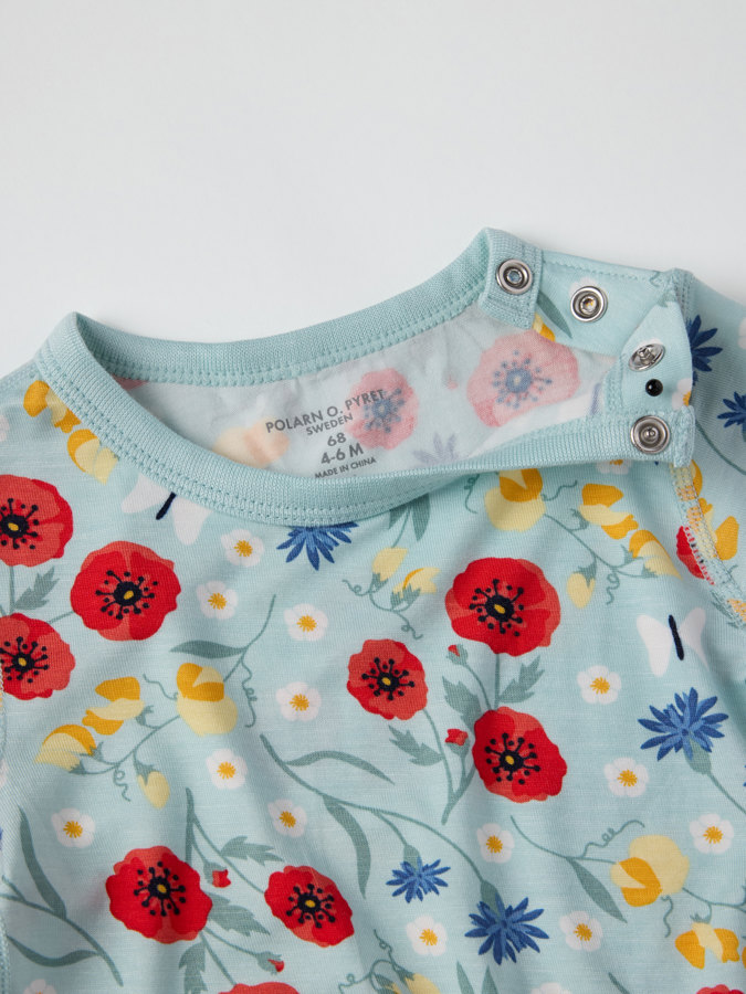 Lyhythihainen body kukkakuviolla Lyhythihainen body kukkakuviolla